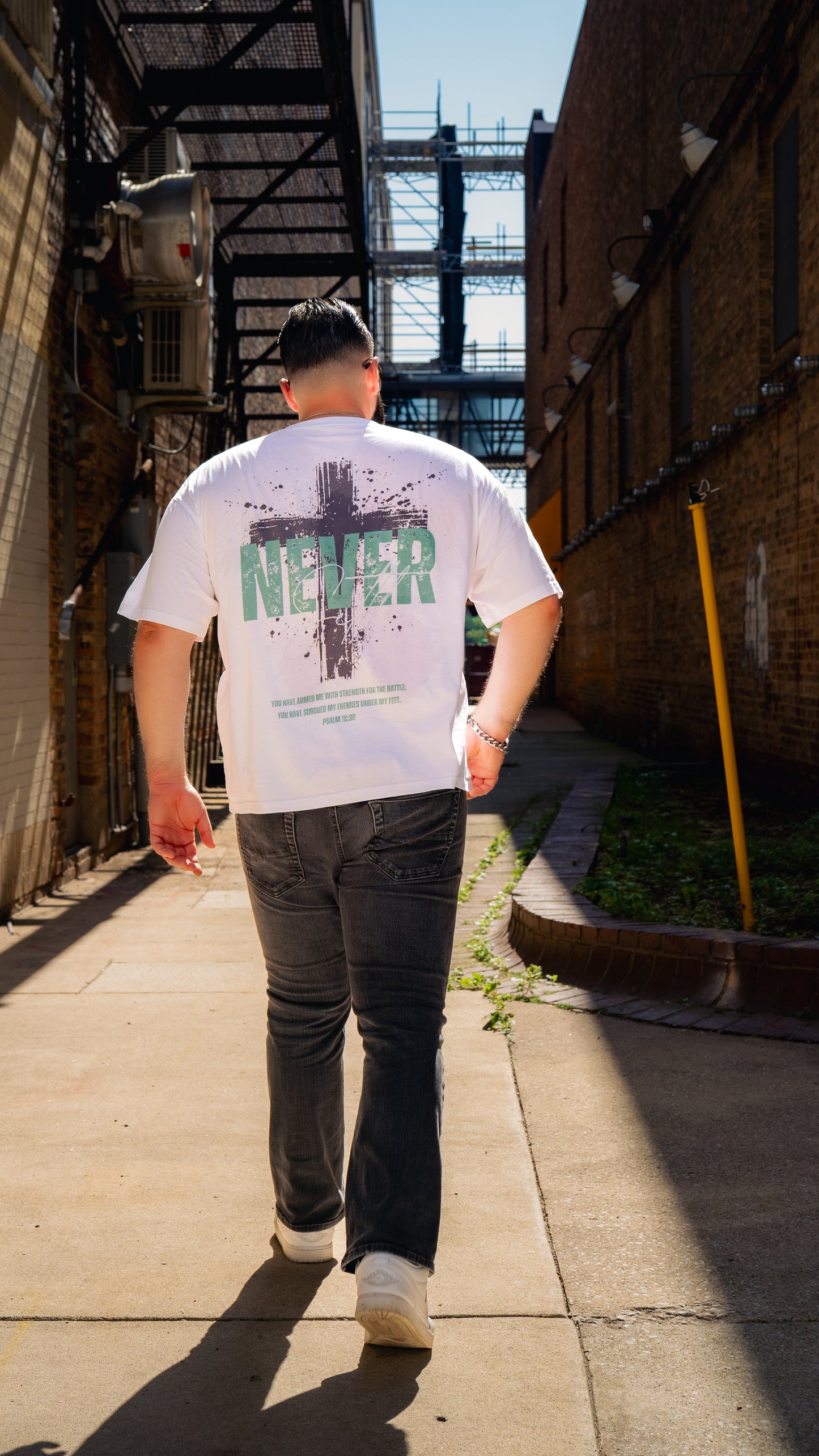 Never Settle | Psalm 18:39 Premium Oversized Tee